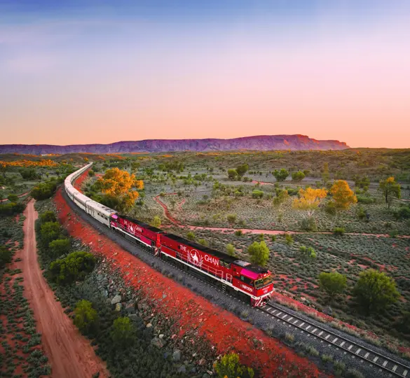 JBRE Ghan Heading North Alice Springs At Sunset Macdonnell Ranges In Background