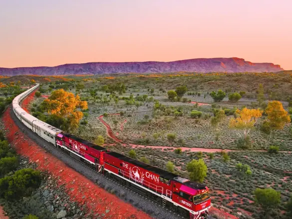 JBRE Ghan Heading North Alice Springs At Sunset Macdonnell Ranges In Background