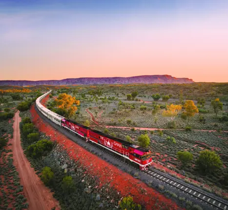JBRE Ghan Heading North Alice Springs At Sunset Macdonnell Ranges In Background