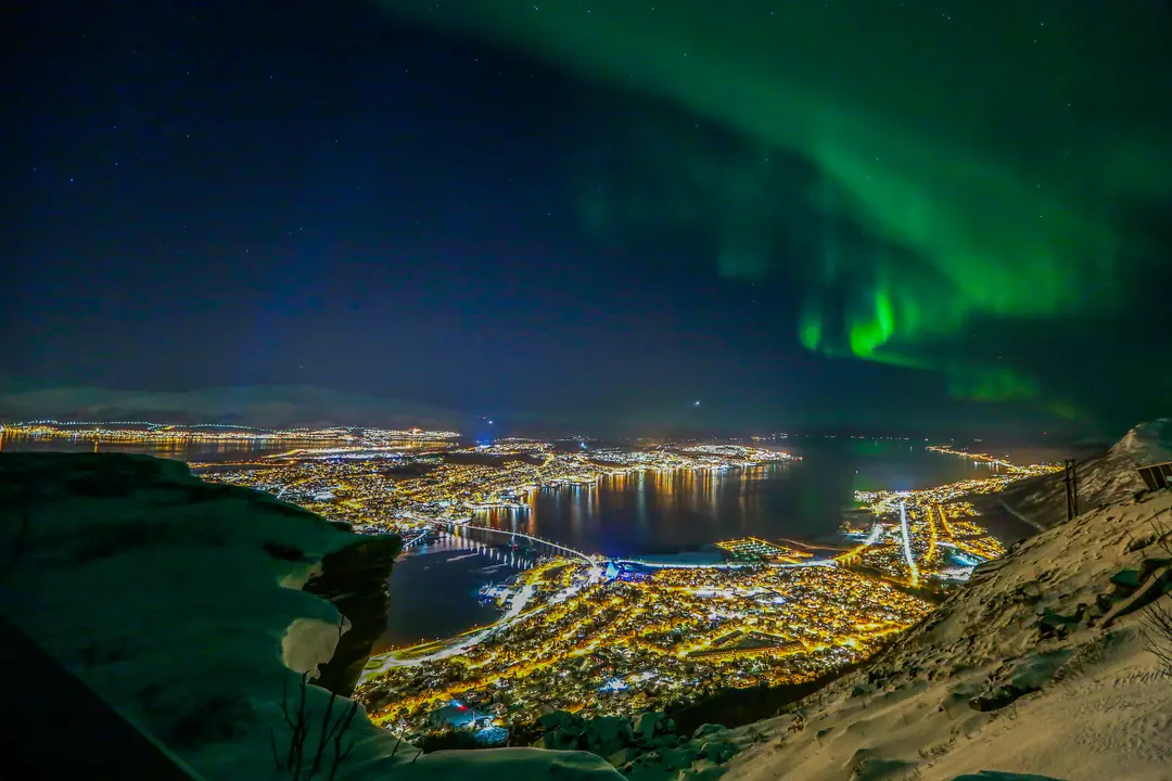 Tromsø In Northern Lights In Winter © Yngve Olsen Visit Norway